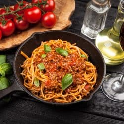 A sauce pan filled with freshly cooked spaghetti, What Tomatoes are Best for Spaghetti Sauce?