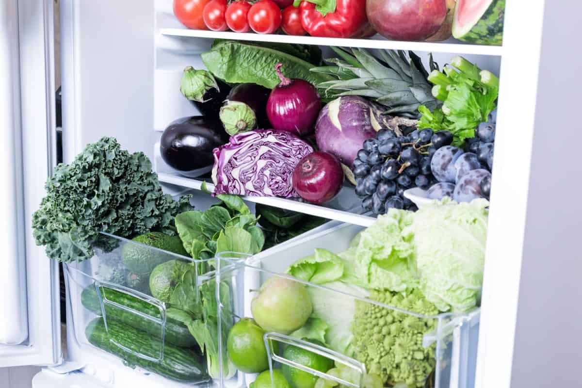 Different kinds of vegetables and fruits inside the fridge