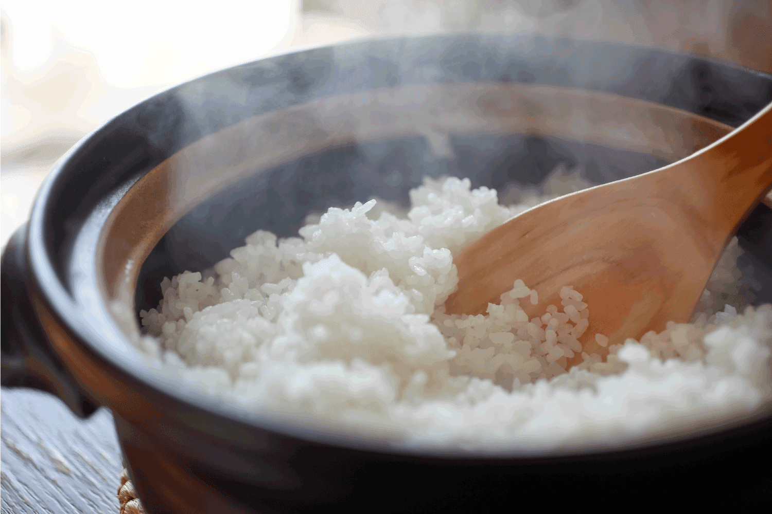 Hot cooked rice with steam rising.