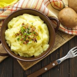Mashed potatoes, boiled puree with fried onions and cutlet in a brown plate on a black slate background, How Long Do Mashed Potatoes Last In The Fridge?