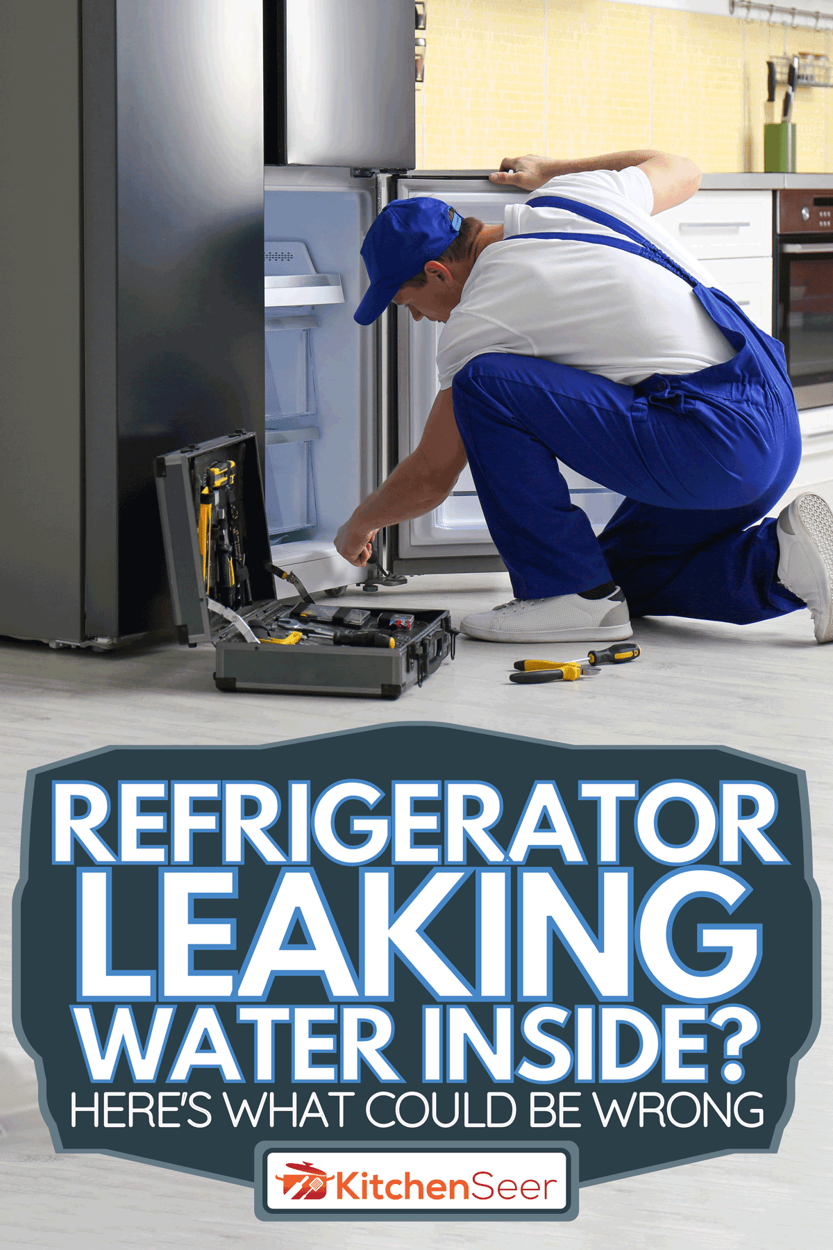 A male technician repairing broken refrigerator in kitchen, Refrigerator Leaking Water Inside? Here's What Could Be Wrong