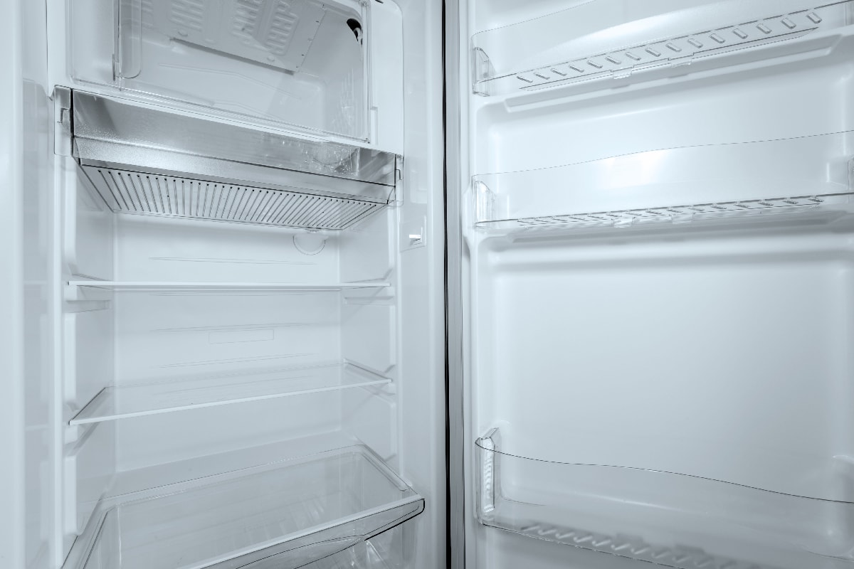 Refrigerator open empty fridge inside interior. close up on empty refrigerator with door open