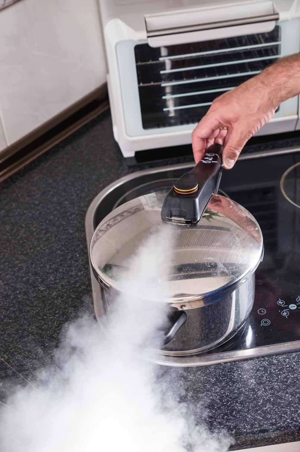 Releasing steam from a pressure cooker
