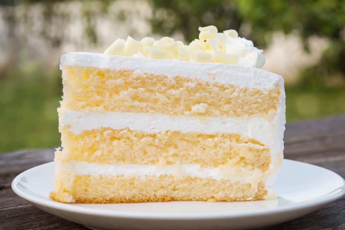 Vanilla sponge cake with cream and white chocolate decorate