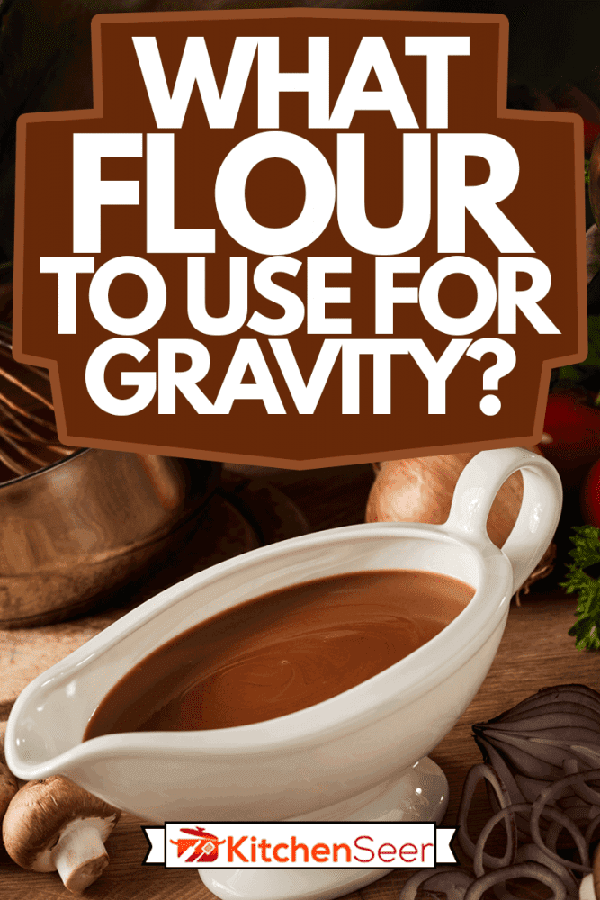 Sauce boat filled with rich brown spicy gravy viewed high angle on a kitchen table with assorted fresh vegetable ingredients, What Flour To Use For Gravy?