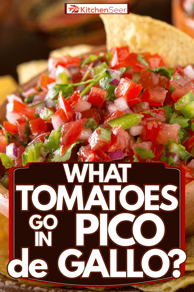 A bowl of Pico de Gallo with tortilla chips on the sides served with citrus, What Tomatoes Go In Pico de Gallo?
