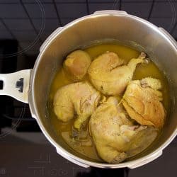 traditional Greek food of chicken stew with onion and lemon juice, cooked in a pressure cooker at home ready to eat, How Long To Cook Chicken In A Pressure Cooker?
