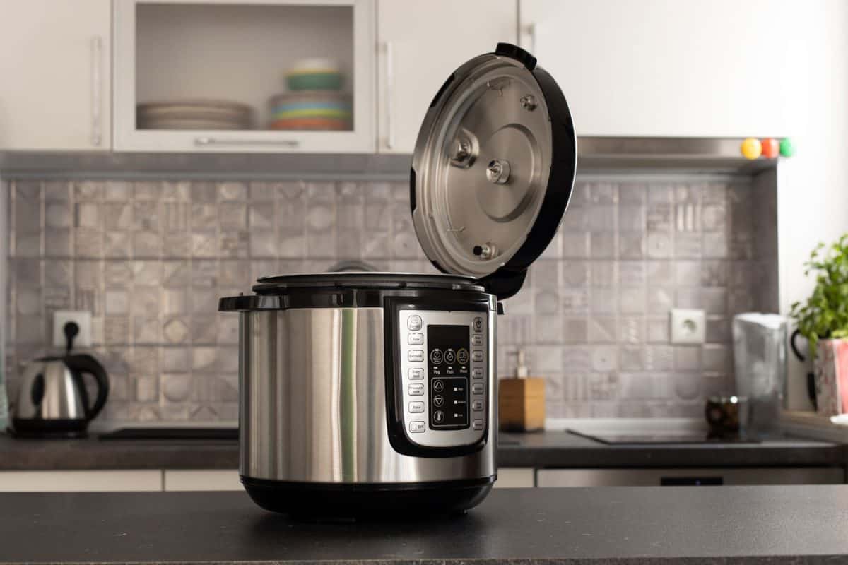 A gray multi cooker in the kitchen countertop