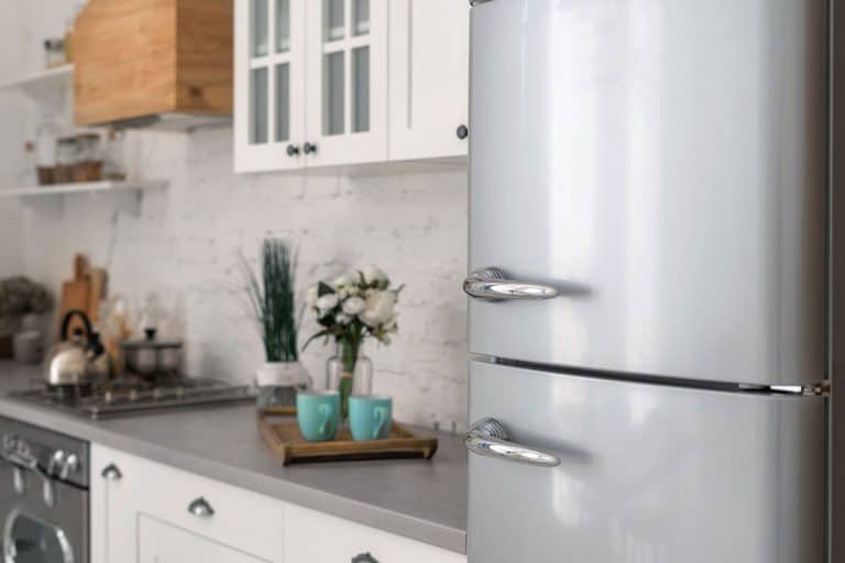 A gray refrigerator at a small modern kitchen, Should A Refrigerator Be Level?