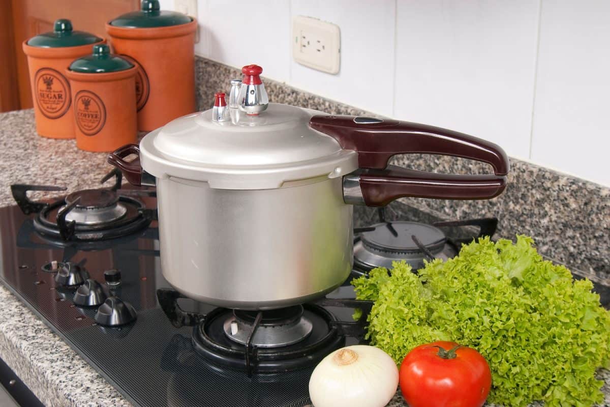 A pressure cooker on the cook top