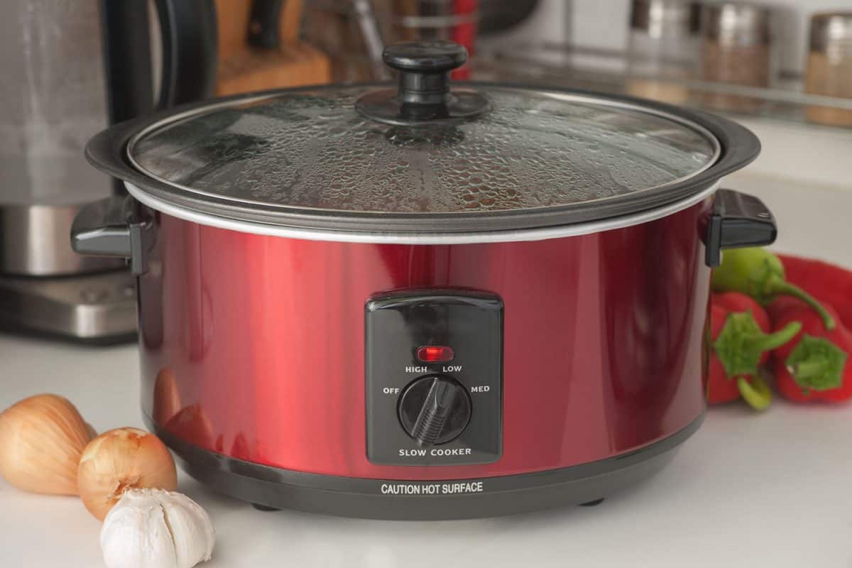 A red slow cooker in the kitchen