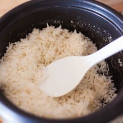 A rice cooker filled with freshly cooked rice, Can Rice Cookers Cook Brown Rice? [And How to]
