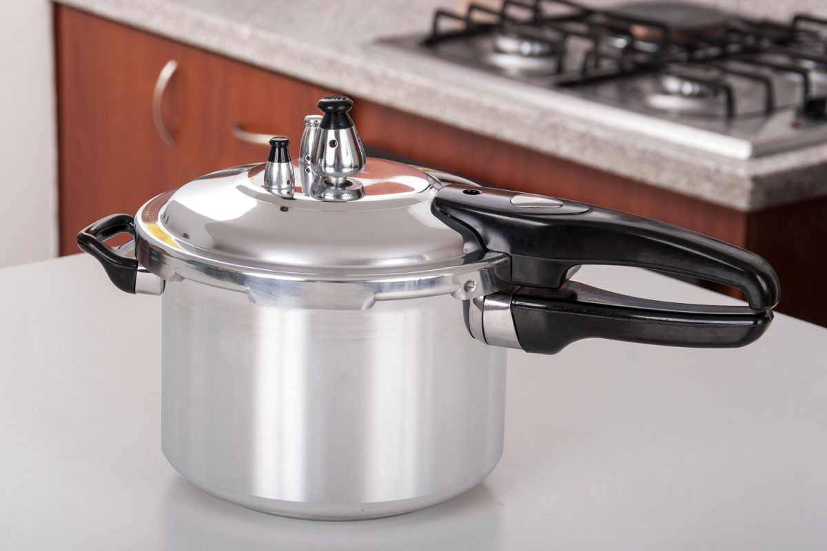 An unused pressure cooker in the countertop 