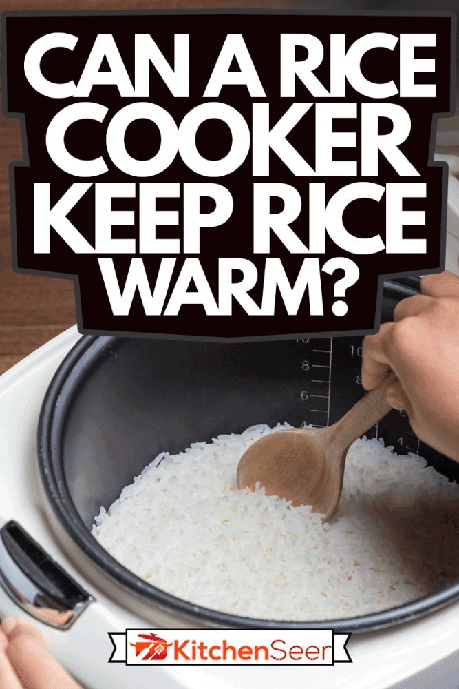 Woman hand is scooping jasmine rice cooking in electric rice cooker with steam, Can A Rice Cooker Keep Rice Warm?