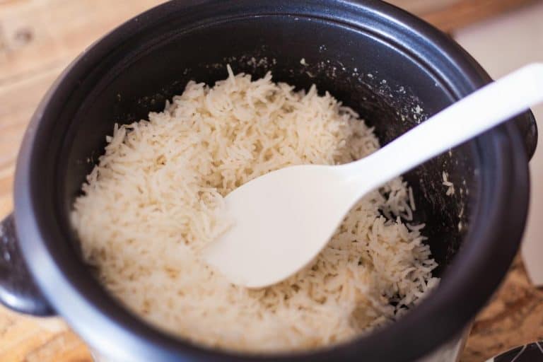 A fresh cooked basmati rice in rice cooker, Why Does My Rice Cooker Burn Rice?