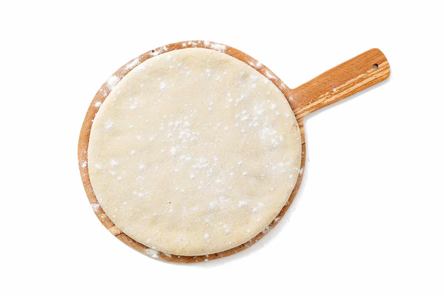 Fresh raw dough for pizza or bread baking on wooden cutting board isolated on white background