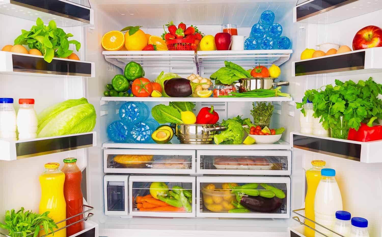 Full open fridge with lots of vegetables