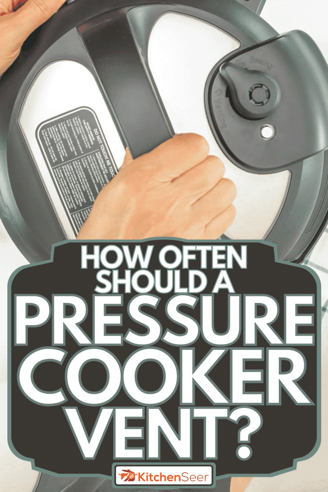 Woman pushing the valve to the venting position, How Often Should A Pressure Cooker Vent?