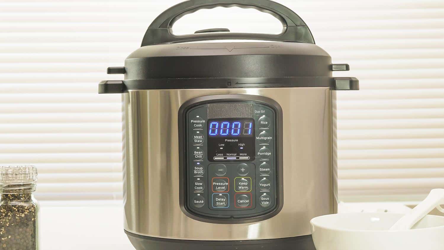 Modern electric multi cooker close up on kitchen table