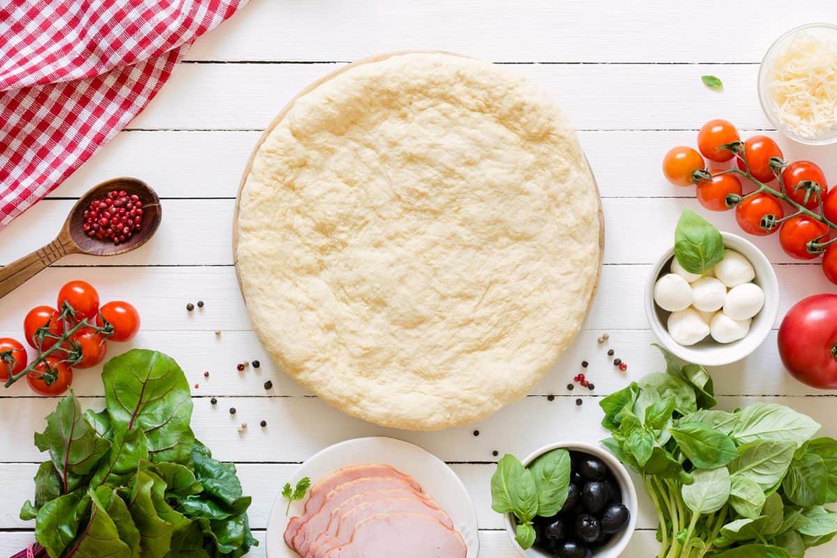 Pizza dough and ingredients for making a pizza