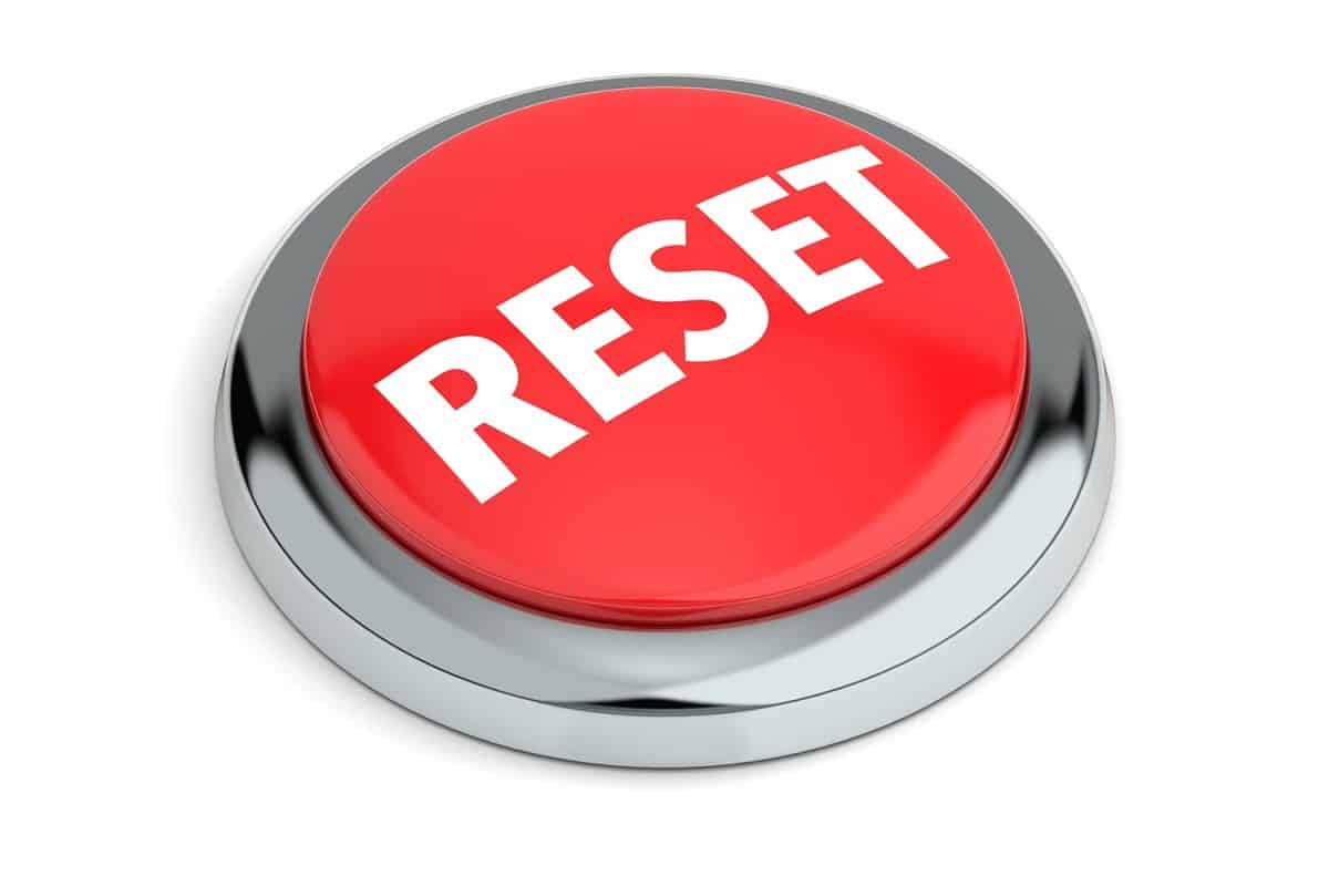 Red reset button isolated on white background