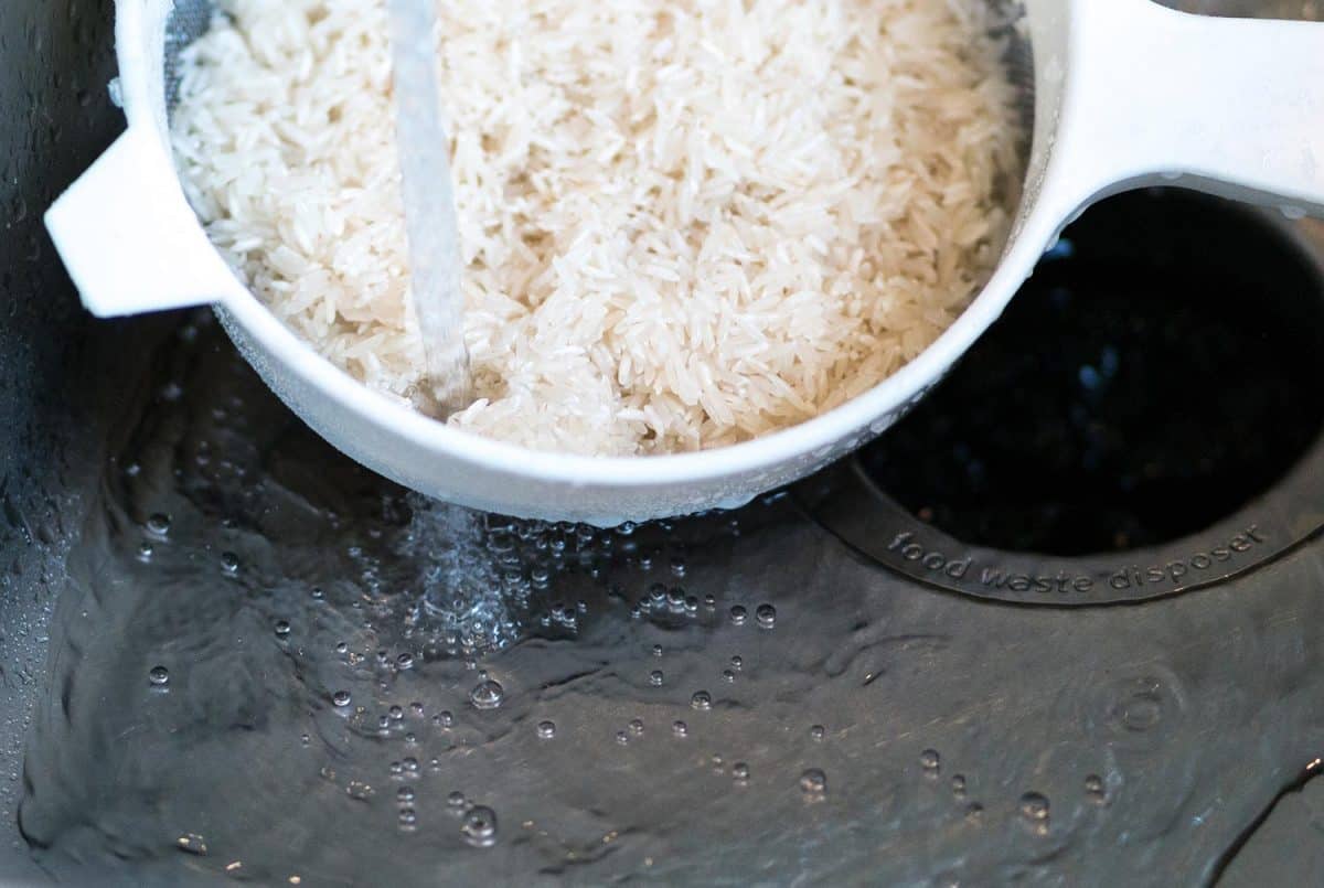 Washing rice in kitchen sink
