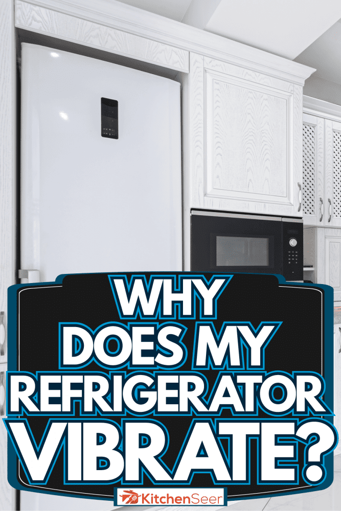 Modern white themed kitchen with white cupboards and cabinets with a huge white fridge, Why Does My Refrigerator Vibrate? 