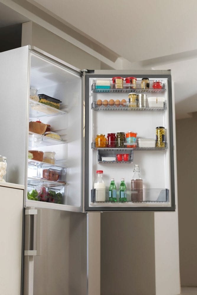 A refrigerator containing lots of food and other essentials