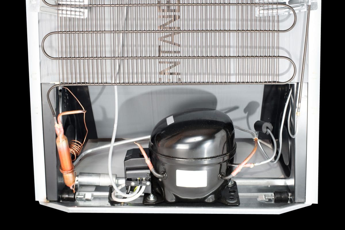 A refrigerator motor on the back of the refrigerator