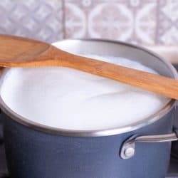 Boiling Milk in Pan with wood spoon as stirir, How Long Does Milk Take To Boil?