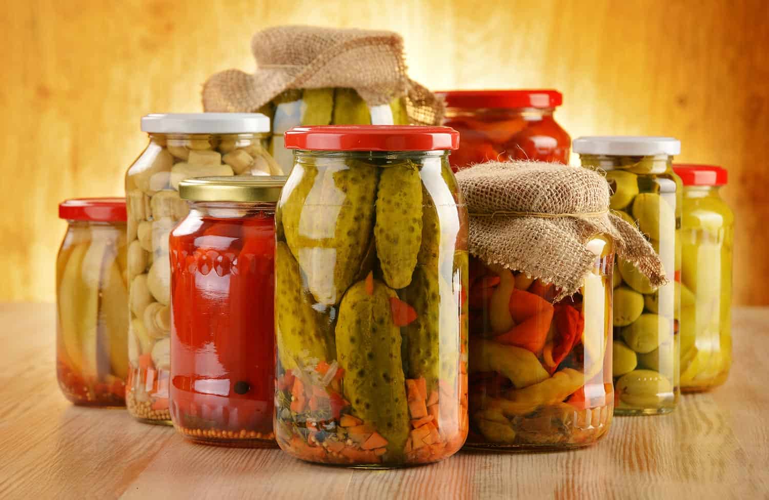 Composition with jars of pickled vegetables