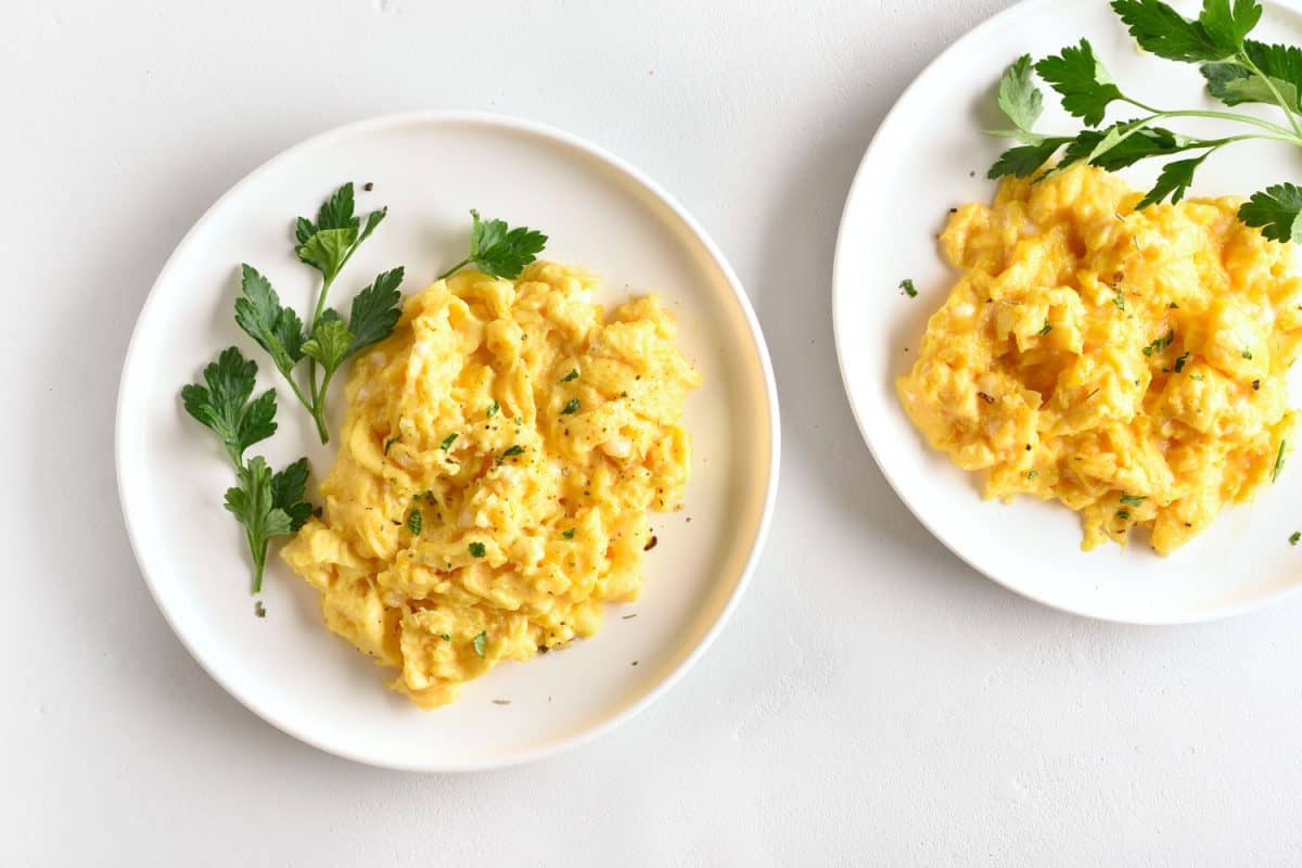 Delicious scrambled eggs garnished with scallions and parsley