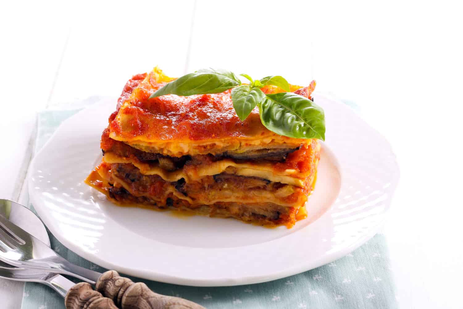 Eggplant and zucchini lasagna slice on plate