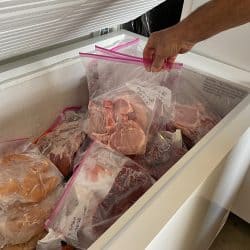 Freezer in a home for portioned frozen meats and meals so food can be purchased in bulk and stored during the pandemic.