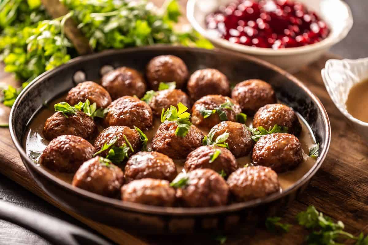 Homemade Swedish meatballs in a pan garnished with parsley