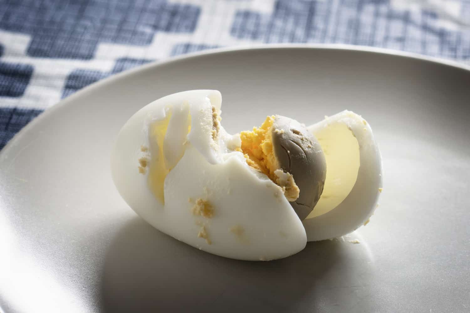 Overcooked Hard Boiled Egg with green or grey tint around the yolk.