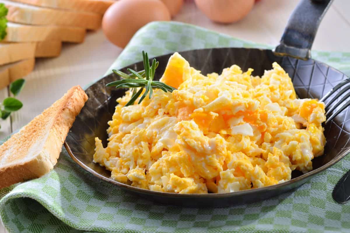 Perfectly cooked scrambled eggs cooked in a non stick skillet