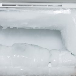 white freezer refrigerator is opened - Why Does My Freezer Have Frost All Of A Sudden? [And How To Fix It]