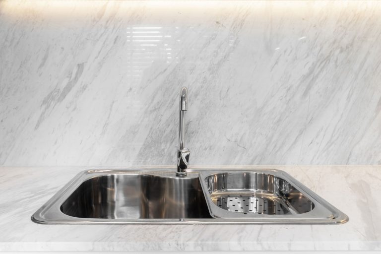 A marble kitchen with a modern steel sink, How Wide Is A Kitchen Sink? [Single And Double]