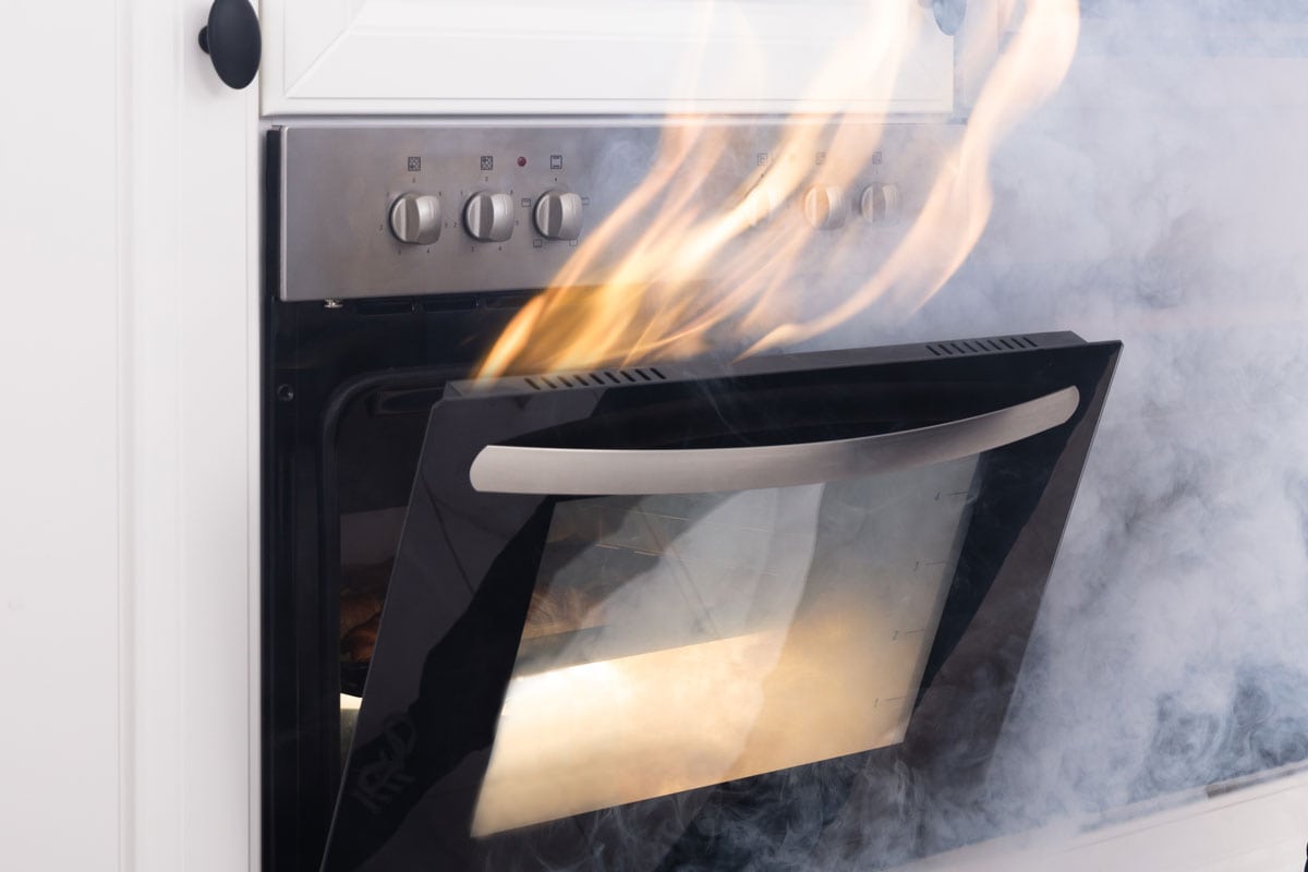 Fire Coming Out From Oven In Kitchen