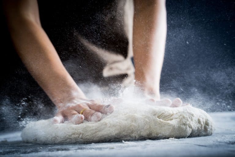 Making dough by female hands at bakery, Pizza Dough Won't Stretch - What To Do?