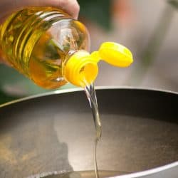Pouring food oil in hot pan for deep frying - Can You Use Vegetable Oil Instead Of Olive OIL