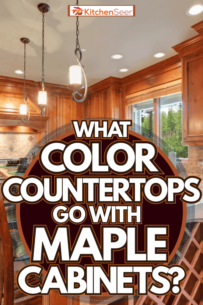 Oak cabinets and cupboards inside a rustic kitchen with hardwood flooring, What Color Countertops Go With Maple Cabinets?