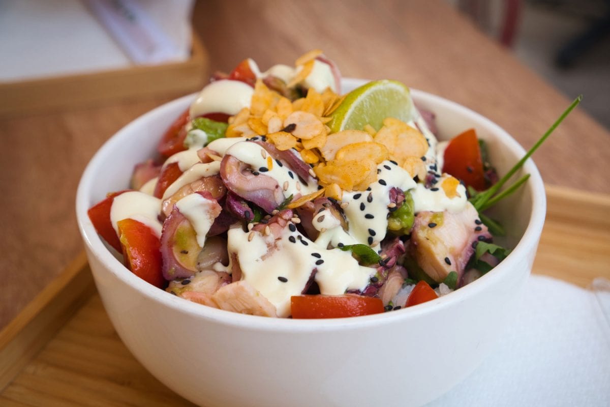 A bowl of delicious Poke with mayonnaise and sesame seeds