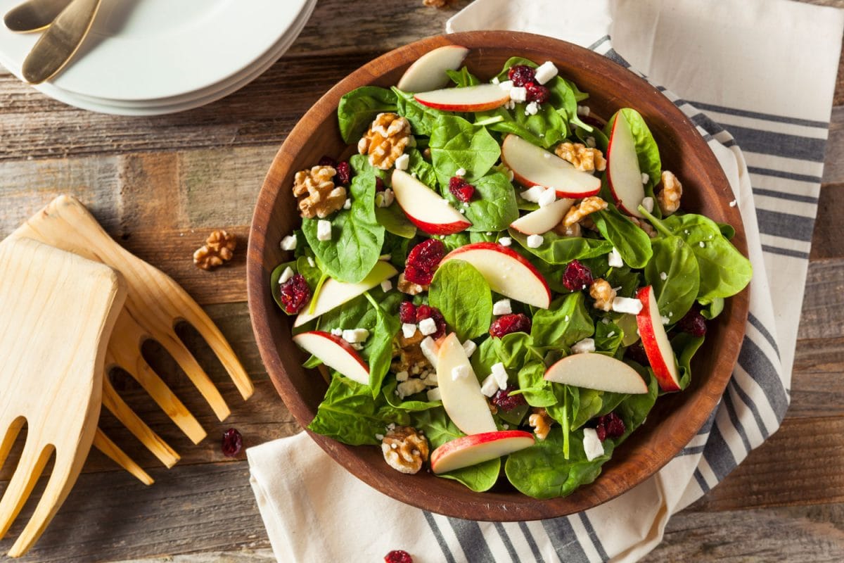 A delicious salad comprising of brussels sprouts, sesame seeds and sliced apples