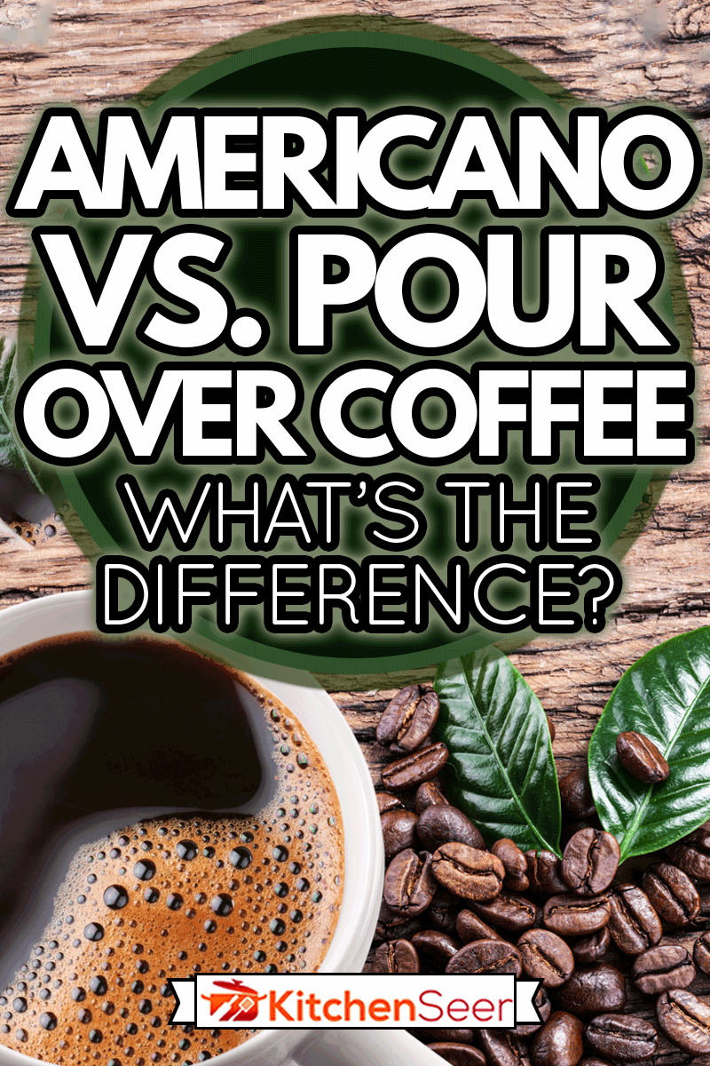 Cup of coffee americano and roasted coffee beans and leaves near the cup on the wooden table, Americano Vs Pour Over Coffee - What's the Difference?