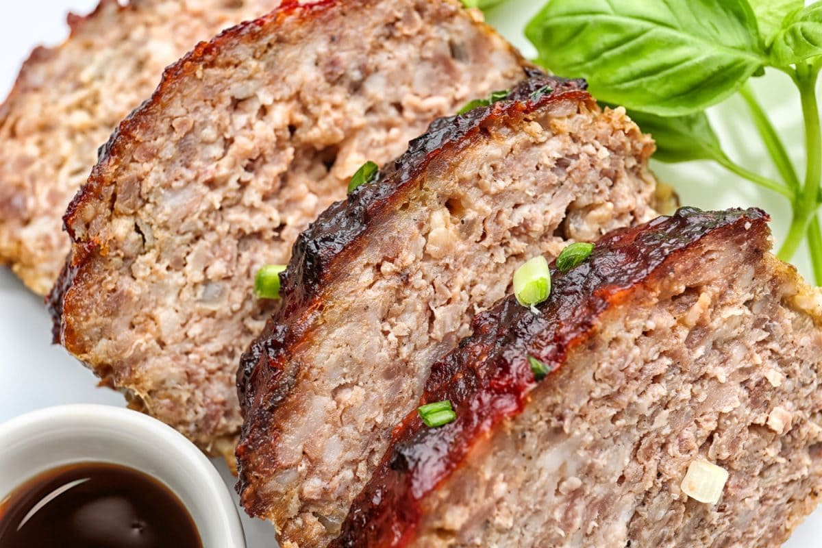 Delicious slices of turkey meatloaf drizzled with scallions