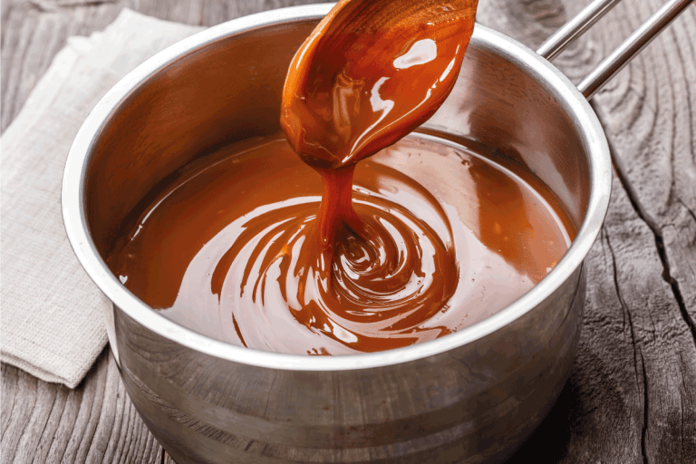 Liquid caramel is poured into a gravy boat. Caramel Sauce Vs Syrup What Are The Differences