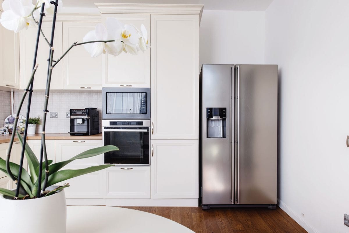 Modern kitchen with a refrigerator in the kitchen corner