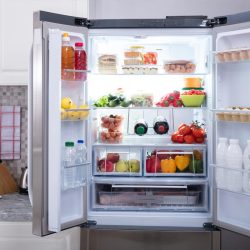 An open refrigerator filled with fresh fruits and vegetables, Can You Drill A Hole In A Refrigerator?